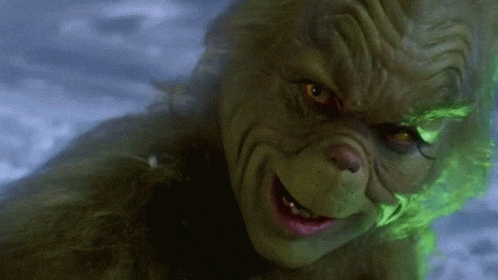 Jim Carrey sonriendo mientras interpreta al Grinch debido a que en el futuro podría interpretar al personaje sin tener que usar ninguna prótesis.- Blog Hola Telcel